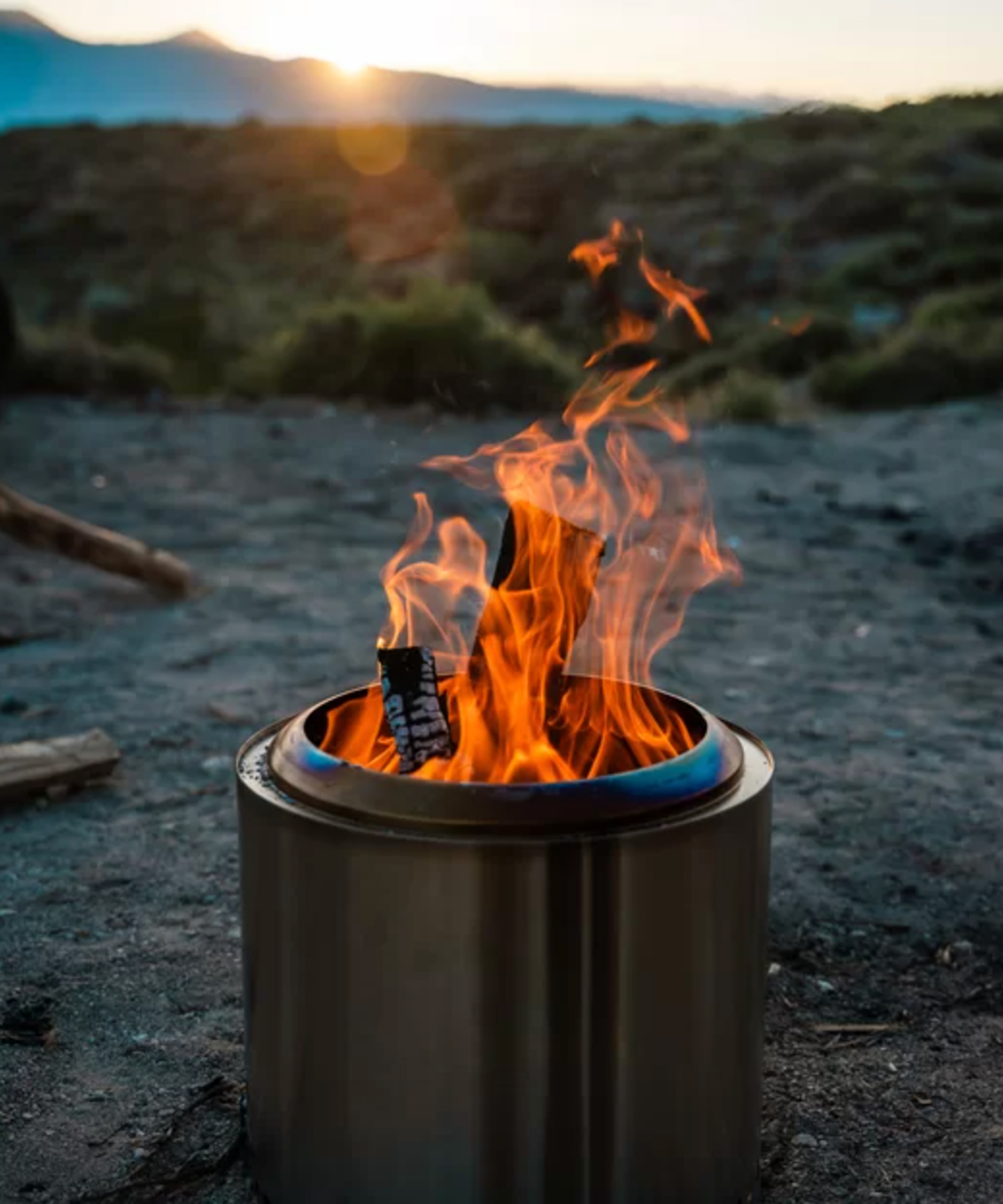 A Solo Stove smokeless fire pit at sunset