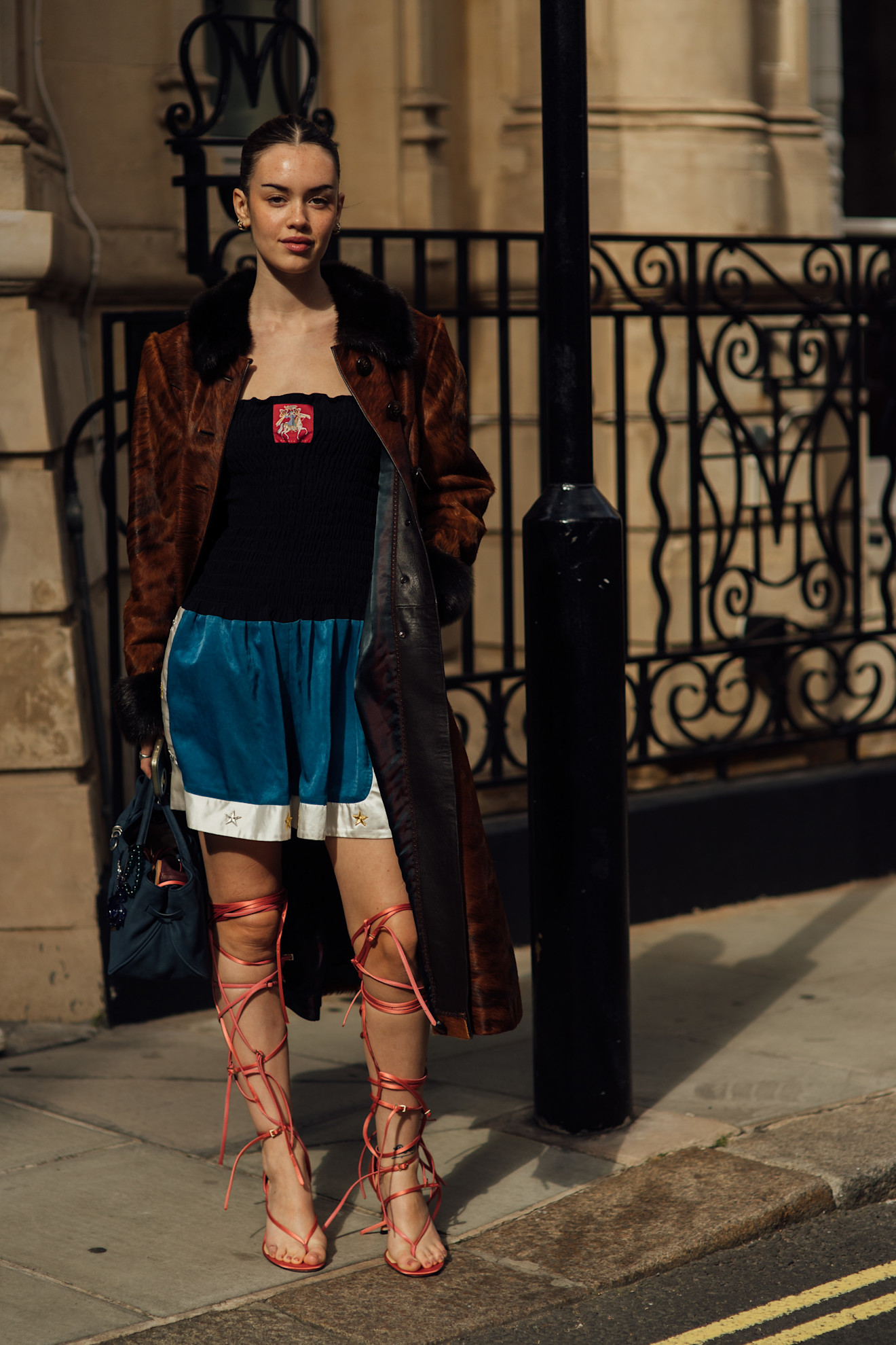 A London Fashion Week guest wore gladiator sandals outside spring shows