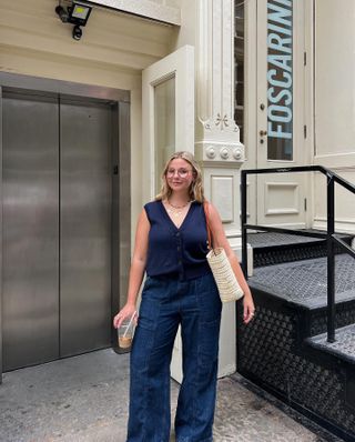 Classic fashion style: @oliviamarcus wears a knit vest with wide-leg trousers and a basket bag