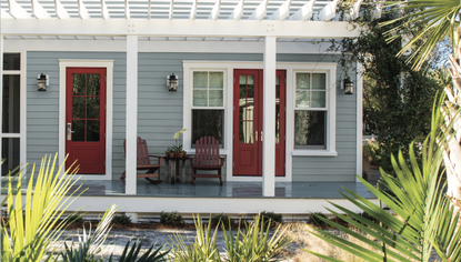 A front porch with painted white trim