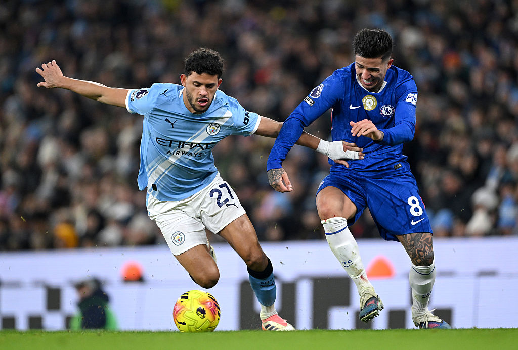 MANCHESTER, ENGLAND - JANUARY 04: Matheus Nunes of Manchester City is challenged by Enzo Fernandez of Chelsea during the Premier League match between Manchester City and Chelsea at Etihad Stadium on January 04, 2026 in Manchester, England. (Photo by Shaun Botterill/Getty Images)