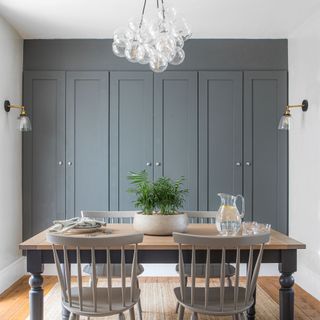 Breakfast room with built in cabinetry and glass pendant light