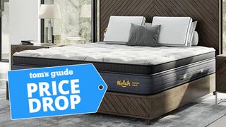 The Nolah Evolution 15 Mattress in a luxury bedroom with a blue price drop sale badge overlaid