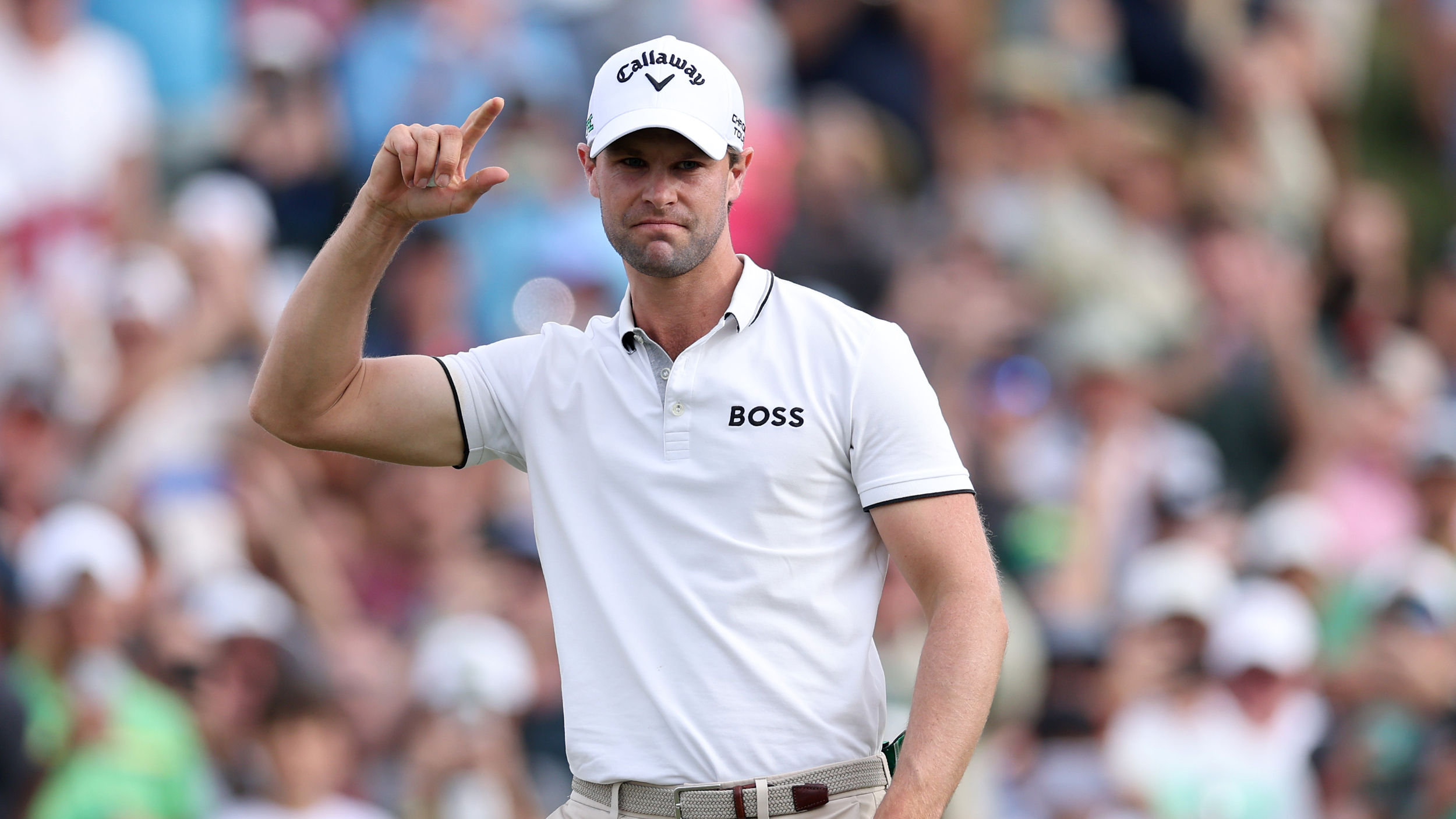 Thomas Detry acknowledges the fans after winning the WM Phoenix Open