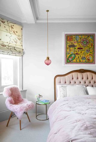 White bedroom with pink bed and bedding