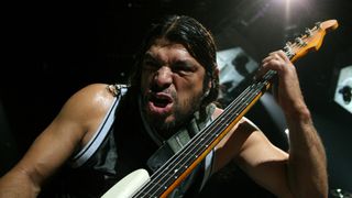 Metallica’s Robert Trujillo, pulling an epic stank face, onstage in 2009
