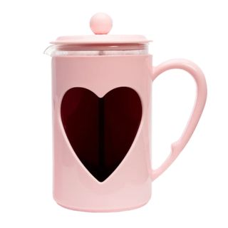 A pink French Press with a heart in its center from Paris Hilton's cookware line
