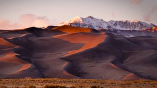 Great Sand Dunes National Park with rocky mountains in the background