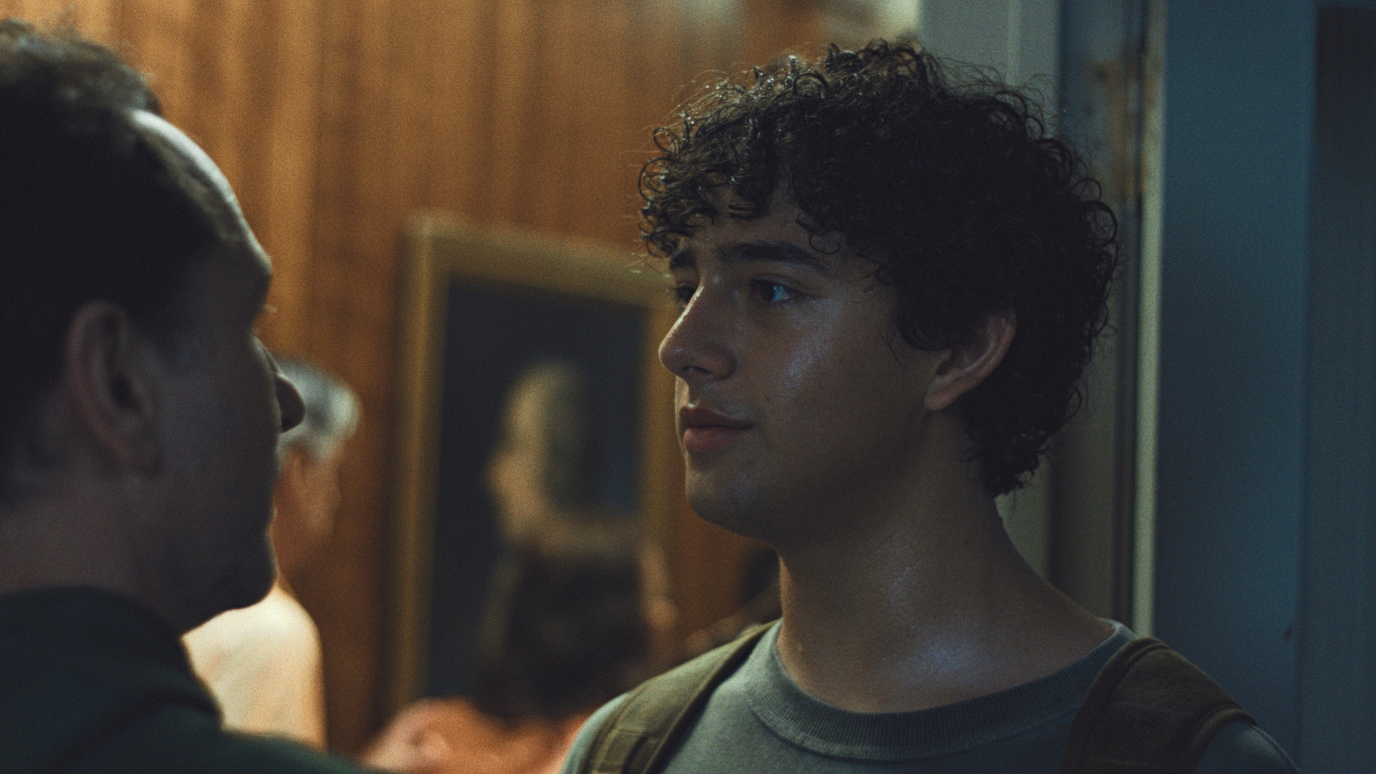 Evan looking at his Dad inside the mayor's office in Widow's Bay Season 1 finale