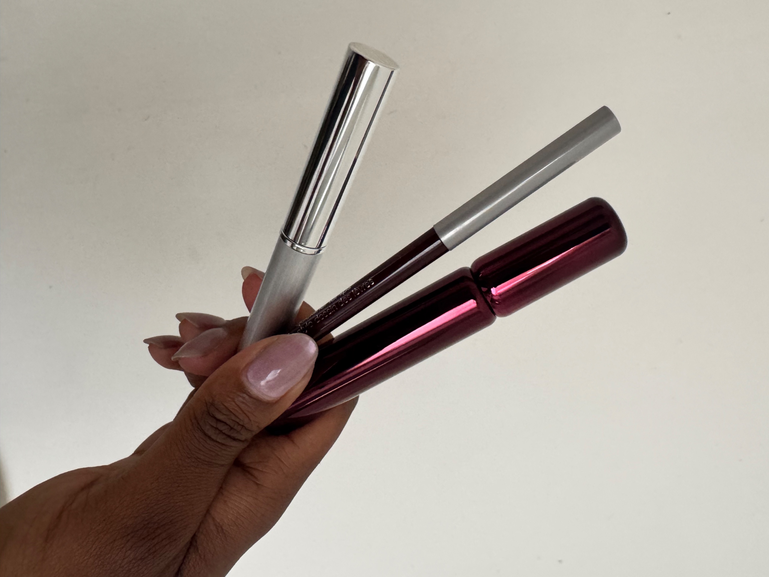 Ata-Owaji Victor holding Clinique's black honey liner, mascara and almost lipstick