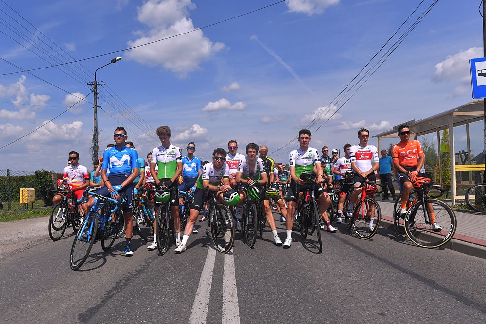 The peloton line up to start a neutralised stage 4 at the Tour de Pologne in memory of Bjorg Lambrecht