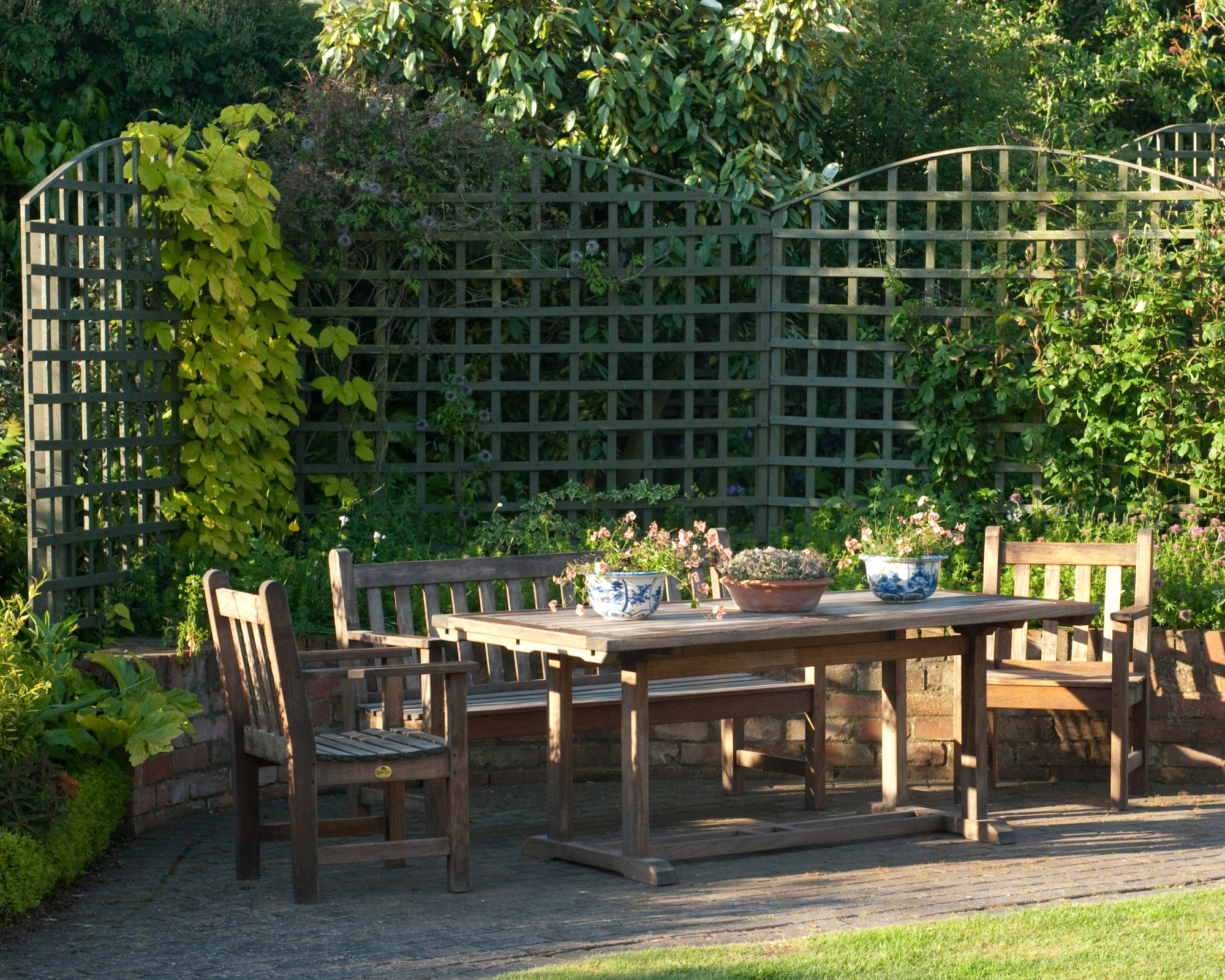 outdoor living space with dining table and trellis