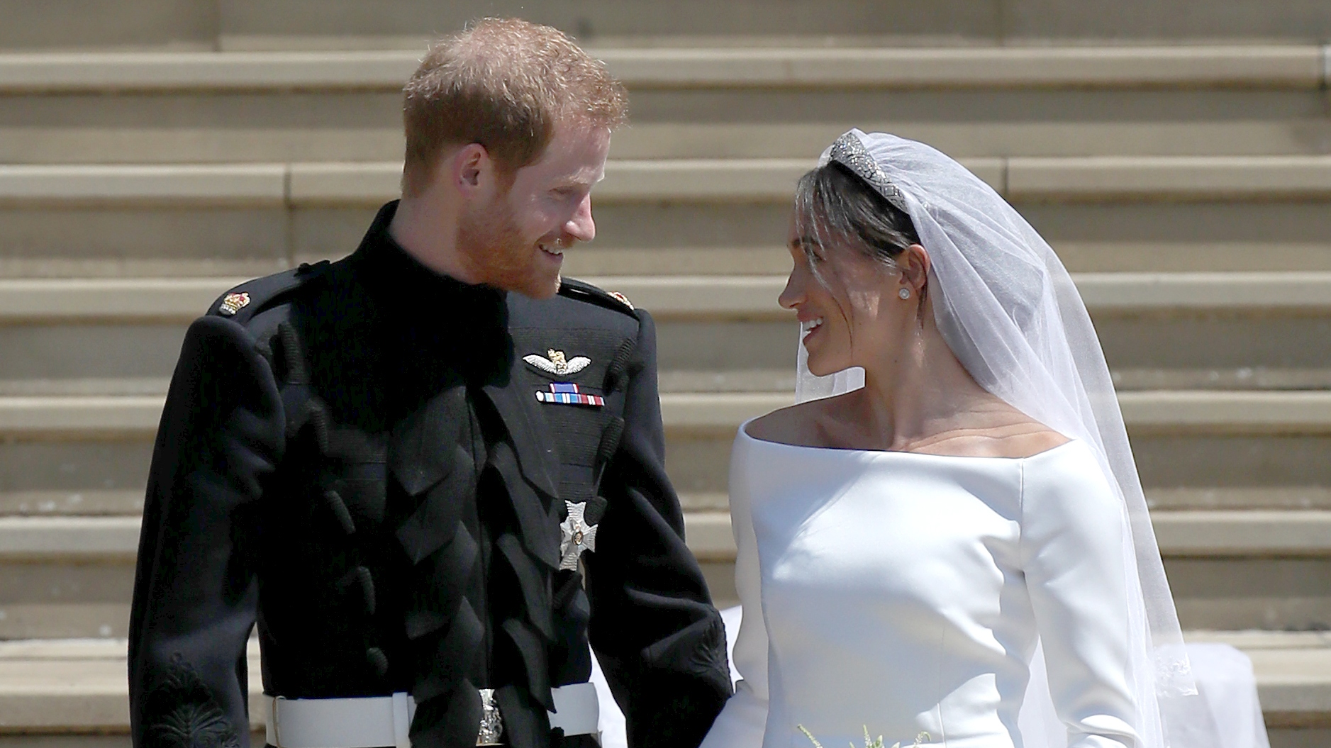 Prince Harry, Duke of Sussex and the Duchess of Sussex depart after their wedding ceremony at St George's Chapel at Windsor Castle on May 19, 2018