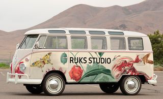 'Flower Power' Volkswagen camper van decorated with details from a 17th Century drawing by Jacob Marrel