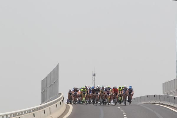 The bunch exited the bridge and returned to the highway