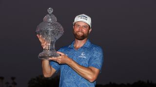 Chris Kirk stands with the Honda Classic trophy after winning at PGA National Resort And Spa in Palm Beach Gardens, Florida