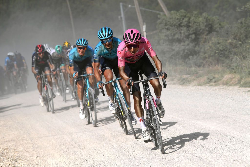 MONTALCINO ITALY MAY 19 Egan Arley Bernal Gomez of Colombia and Team INEOS Grenadiers Pink Leader Jersey Gorka Izagirre Insausti of Spain and Team Astana Premier Tech during the 104th Giro dItalia 2021 Stage 12 a 162km stage from Perugia to Montalcino 554m Dust Gravel Strokes girodiitalia UCIworldtour Giro on May 19 2021 in Montalcino Italy Photo by Tim de WaeleGetty Images