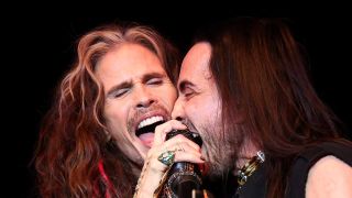 Steven Tyler and Nuno Bettencourt share a mic