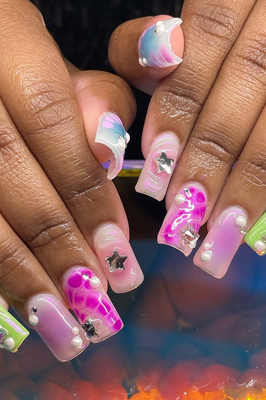 A Y2K manicure featuring a little bling.
