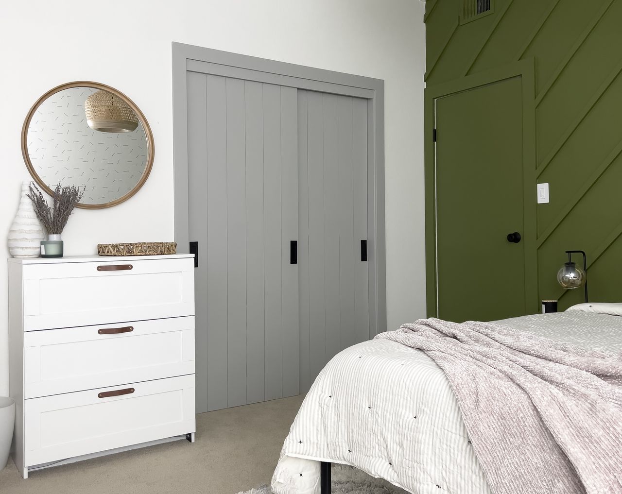 An IKEA PAX painting in a soft grey with shiplap effect doors in a modern bedroom