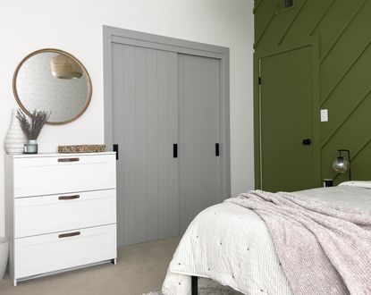 An IKEA PAX painting in a soft grey with shiplap effect doors in a modern bedroom