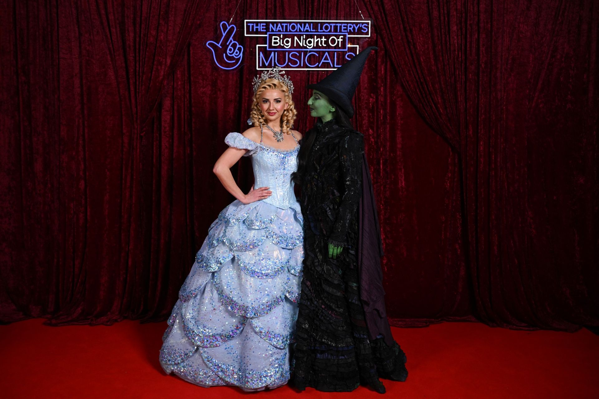 Zizi Strallen and Emma Kingston in their costumes from the musical Wicked