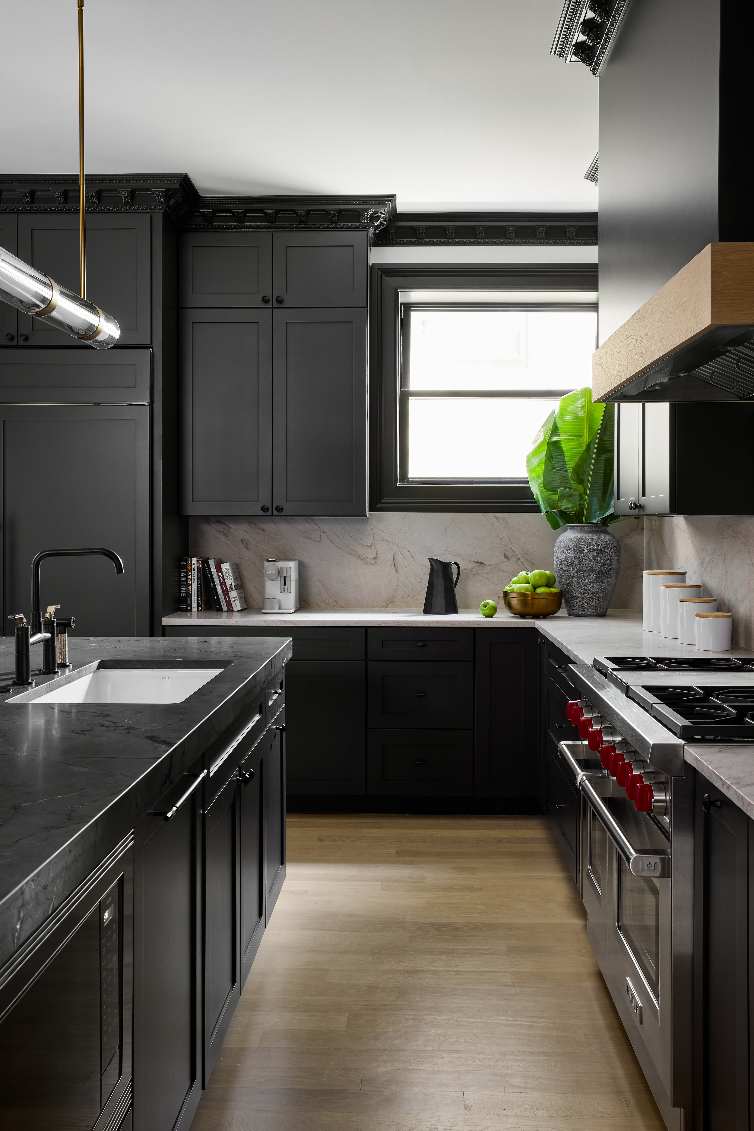 A kitchen designed in a black color scheme