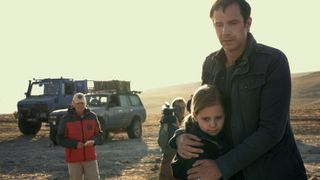 James D'Arcy as Magnus hugs Davina/Rosie Coleman as Alice in the desert in Constellation