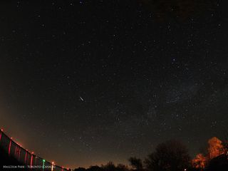 A brilliant meteor streaks over Toronto, Canada in this photo by Malcolm Park shared by the photographer and Virtual Telescope Project during the Camelopardalid meteor shower created by Comet 209P/LINEAR early on May 24, 2014.