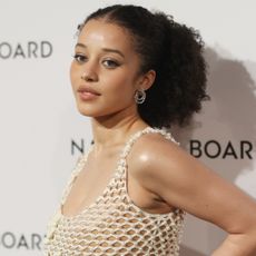 Chase Infiniti attended the National Board of Review gala in a fishnet ivory Oscar de la Renta dress