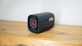 AnkerWork C310 webcam on a wooden surface