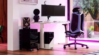 The Herman Miller Vantum in Purple next to a gaming desk and RGB lighting