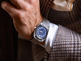 blue watch on man's wrist