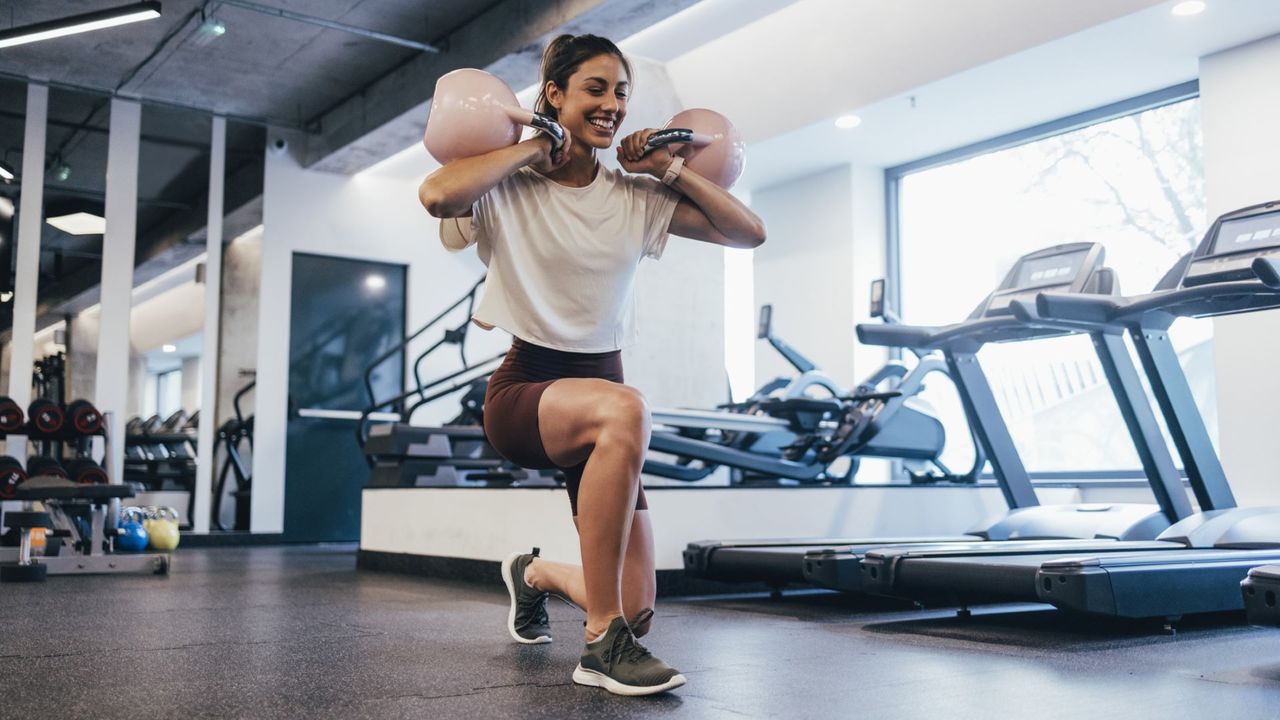 Woman does kettlebell workout