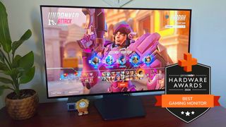 LG UltraGear 32GS95UE-B gaming monitor on a desk running Overwatch 2 with a GamesRadar+ Hardware Awards badge