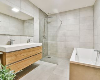 Neutral bathroom with wooden vanity
