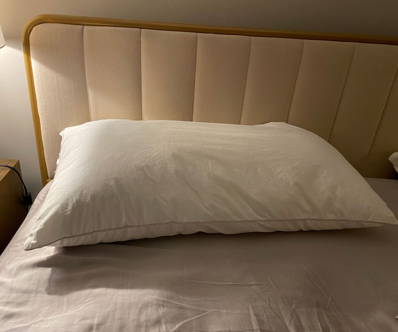 Sleep Number PlushComfort Classic Pillow on a bed.