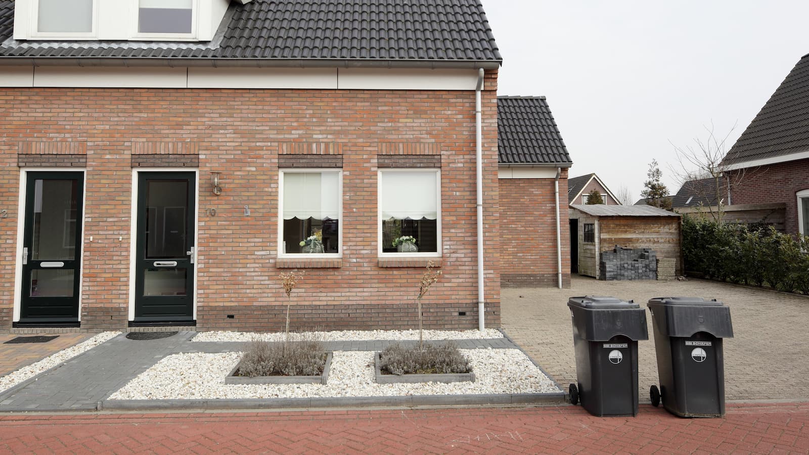 Brand new garden, designed with gravel and miniature trees