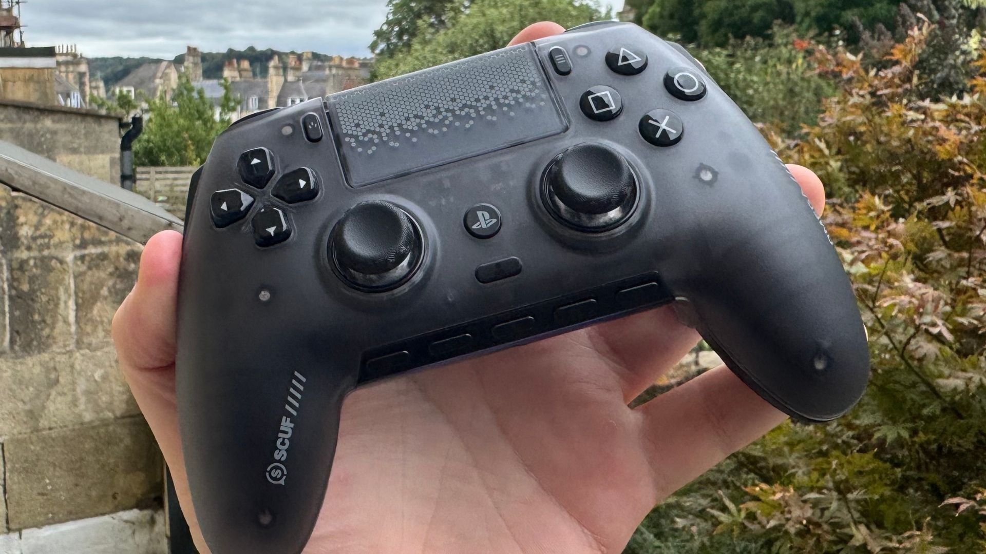 Scuf Omega controller outside in a hand