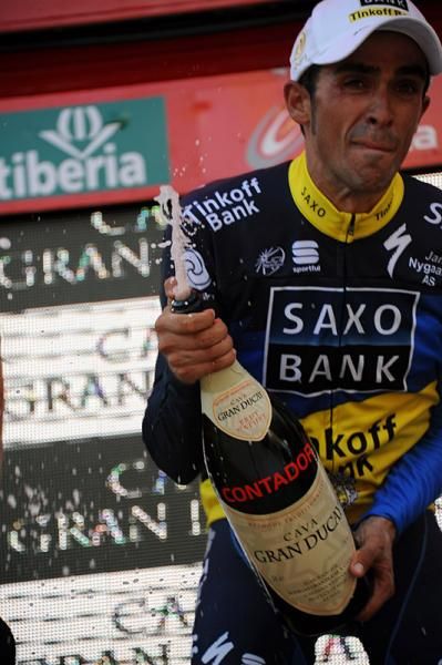 It's party time on the podium as Alberto Contador uncorks the bubbly.