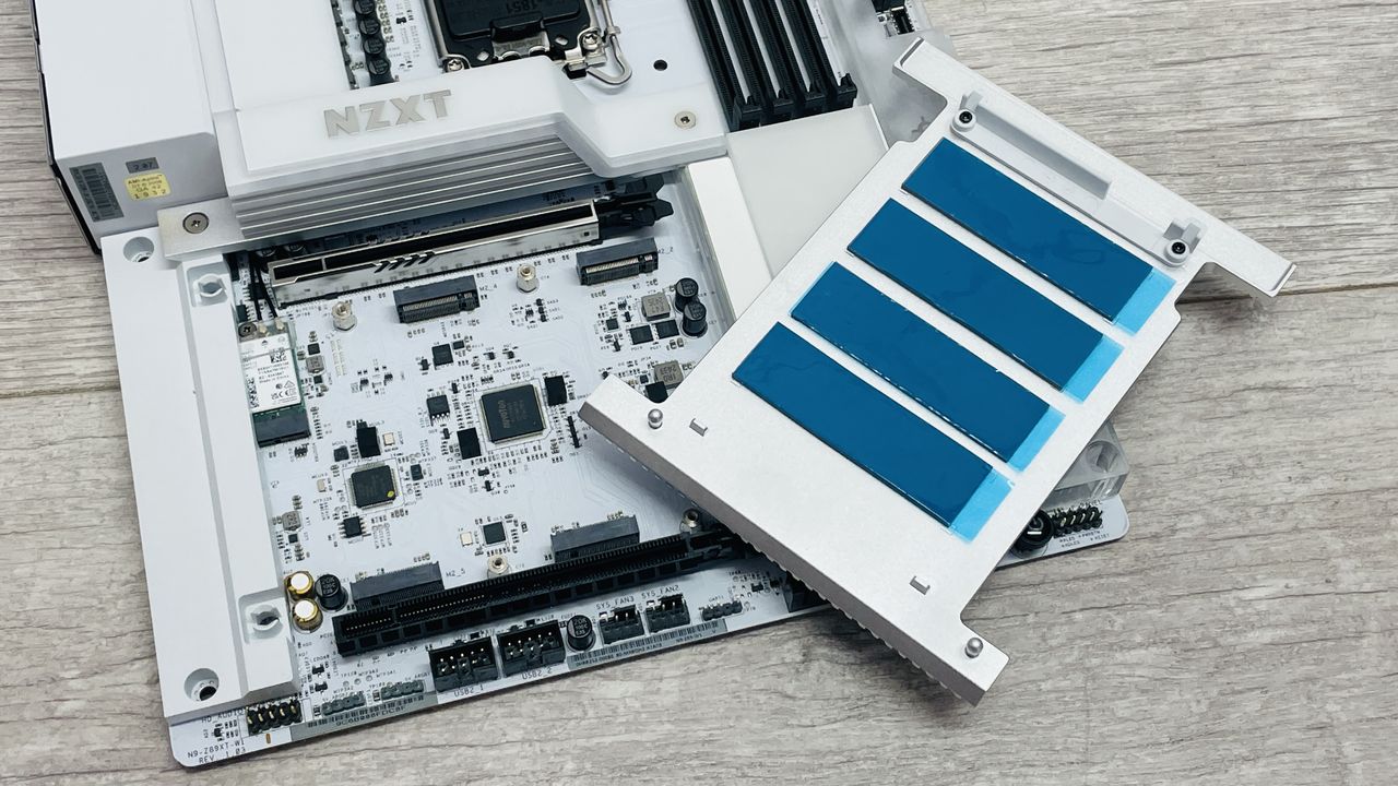An NZXT N9 Z890 motherboard on a desk with port covers removed.