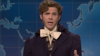 Mikey Day addresses Weekend Update as Lord Gaga in an aristocratic outfit.