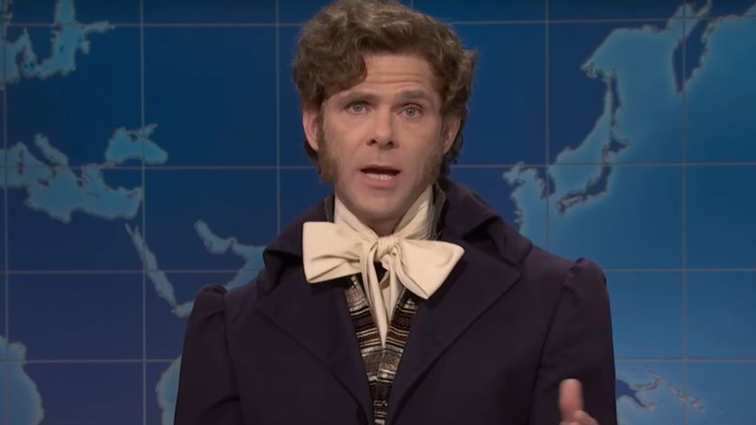 Mikey Day addresses Weekend Update as Lord Gaga in an aristocratic outfit.