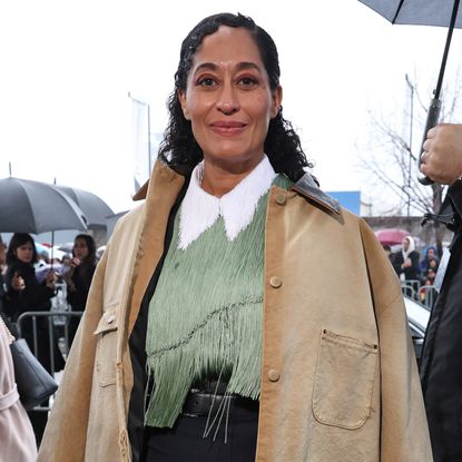 Tracee Ellis Ross wearing a utility style coat with a fringe top