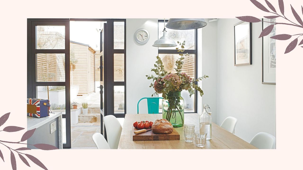 picture of kitchen with flowers, door open and light furnishings