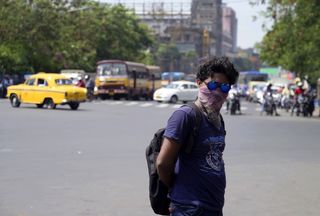 man in heat wave in kolkata