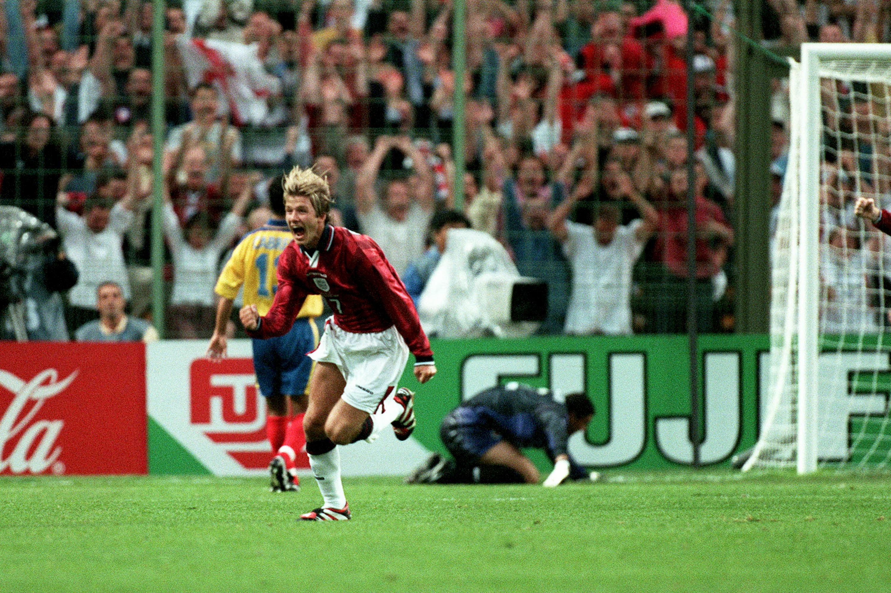David Beckham celebrates after scoring a free-kick for England against Colombia at the 1998 World Cup.