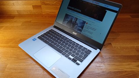 Acer Chromebook 314 review, a photo of a laptop on a wooden table with its lid open