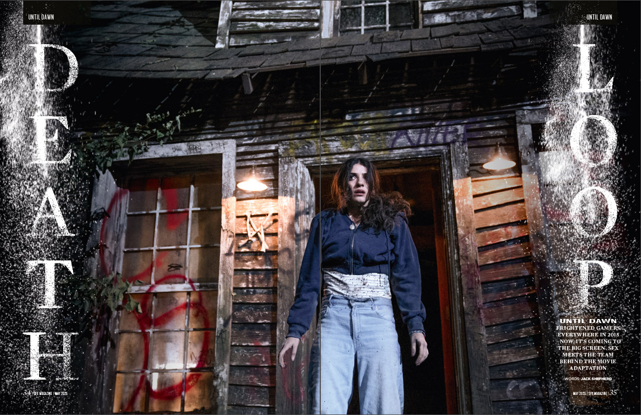 Clover (Ella Rubin) in front of a graffitied cabin.