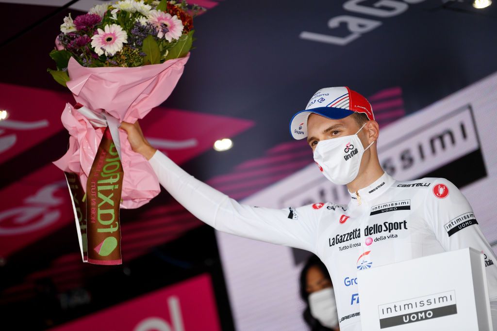 CATTOLICA ITALY MAY 12 Attila Valter of Hungary and Team Groupama FDJ white best young jersey celebrates at podium during the 104th Giro dItalia 2021 Stage 5 a 177km stage from Modena to Cattolica Trophy Mask Covid safety measures girodiitalia Giro on May 12 2021 in Cattolica Italy Photo by Tim de WaeleGetty Images
